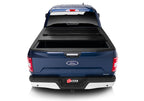 BAK 21-22 Ford F-150 (Incl. 2022 Lightning) BAKFlip FiberMax 5.7ft Bed Cover view from the rear showcasing truck accessories.