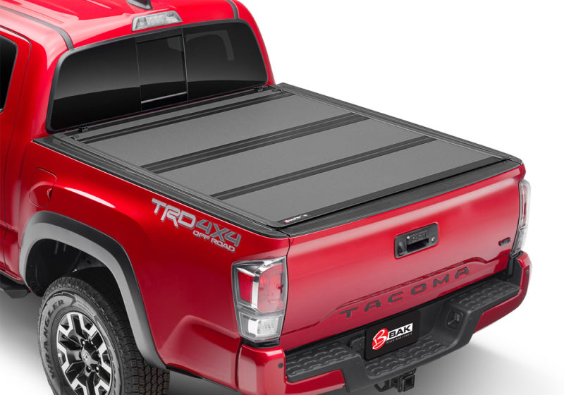 BAK 16-20 Toyota Tacoma 6ft Bed BAKFlip MX4 Matte Finish on red truck.