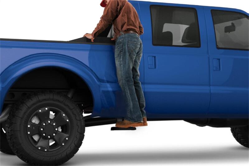 AMP Research 17-22 Ford F-250/350 SuperDuty All Beds BedStep2 - Black in use for easy access to truck bed.