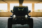 DV8 Offroad 2018+ Jeep Wrangler JLO A Pillar Dual Light Pod Mounts on a Jeep under parking garage.