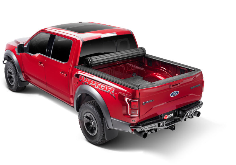 BAK 17-21 Honda Ridgeline Revolver X4s 5.4ft Bed Cover on red Ford Raptor truck.
