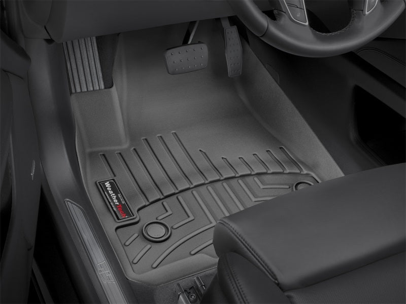 WeatherTech 2017+ Cadillac XT5 Front FloorLiner - Black installed in vehicle interior.
