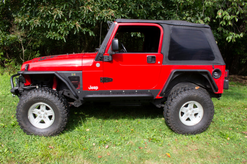 Fishbone Offroad 97-06 Jeep Wrangler TJ Steel Rock Slider - Black Textured Powdercoat on red Jeep
