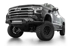 Addictive Desert Designs2022+ Chevrolet Silverado 1500 Black Label Front Bumper with offroad wheels and lighting.