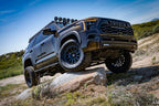 ICON 2022 Toyota Tundra Billet Upper Control Arm Delta Joint Pro Kit on off-road terrain with robust tires.