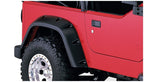 Bushwacker 97-06 Jeep TJ Pocket Style Flares 4pc - Black on red Jeep with offroad tires and wheels.