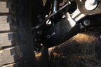 DV8 Offroad 21-22 Ford Bronco Front Lower Control Arm Skid Plate in action, showcasing offroad durability and protection.