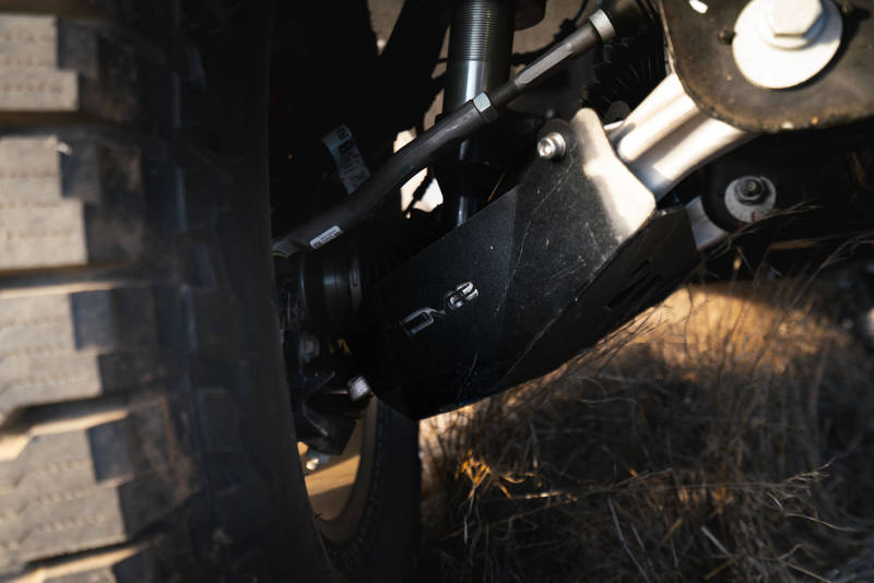 DV8 Offroad 21-22 Ford Bronco Front Lower Control Arm Skid Plate in action, showcasing offroad durability and protection.