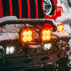 KC HiLiTES FLEX ERA 4 Light Shield Hard Cover (ea) - Amber on Jeep in snow
