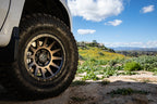 ICON Compression 17x8.5 6x5.5 0mm Offset 4.75in BS 106.1mm Bore Bronze Wheel on offroad terrain
