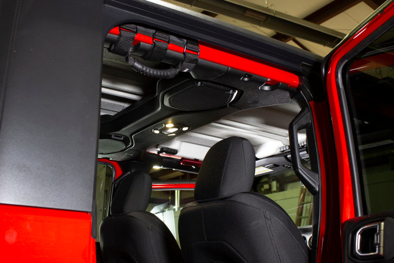 Fishbone Offroad Grab Handles w Three Straps mounted in red Jeep.