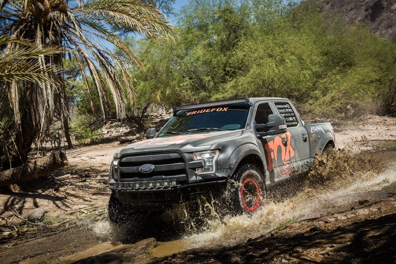 Fox 18-19 Ford F-250 SD 4WD 2.0 Perf Series 10.6in. Smooth Body IFP Front Shock / 5.5-7in Lift on offroad terrain