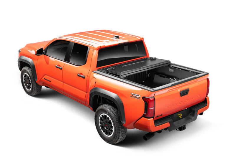 BAK 16-20 Toyota Tacoma 6ft Bed BAKFlip G2 on an orange truck