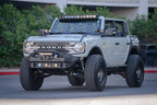 DV8 Offroad 21-22 Ford Bronco Front Lower Control Arm Skid Plate on customized offroad vehicle.