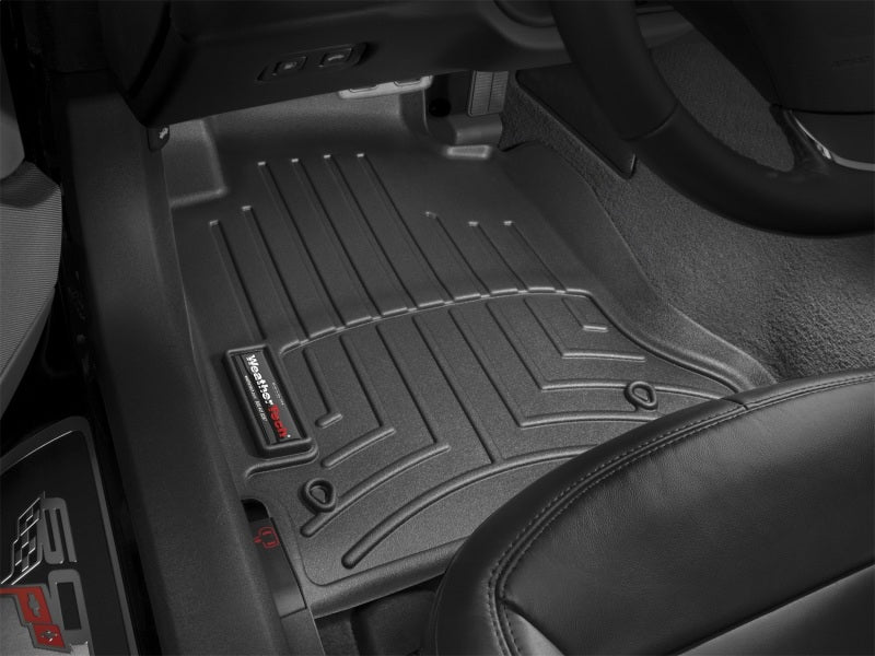 WeatherTech 05-12 Chevrolet Corvette Front FloorLiner - Black installed inside vehicle for complete floor protection.