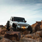 KC HiLiTES FLEX ERA LED 20in. Light Bar - Master Kit on Jeep in rocky terrain for offroad adventure.