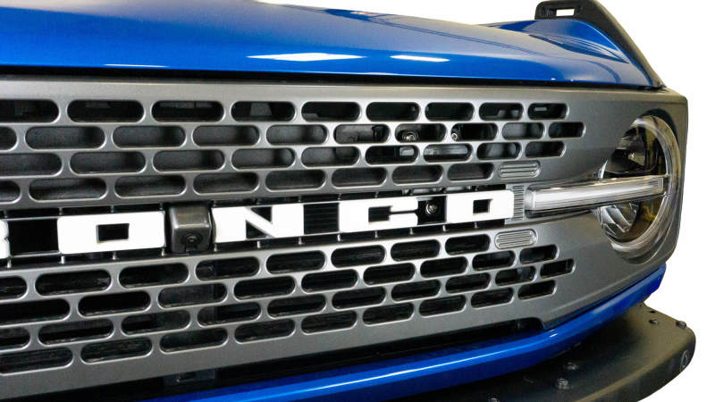 DV8 Offroad 2021+ Ford Bronco Adaptive Cruise Control Relocation Bracket close-up view for offroad performance upgrades.