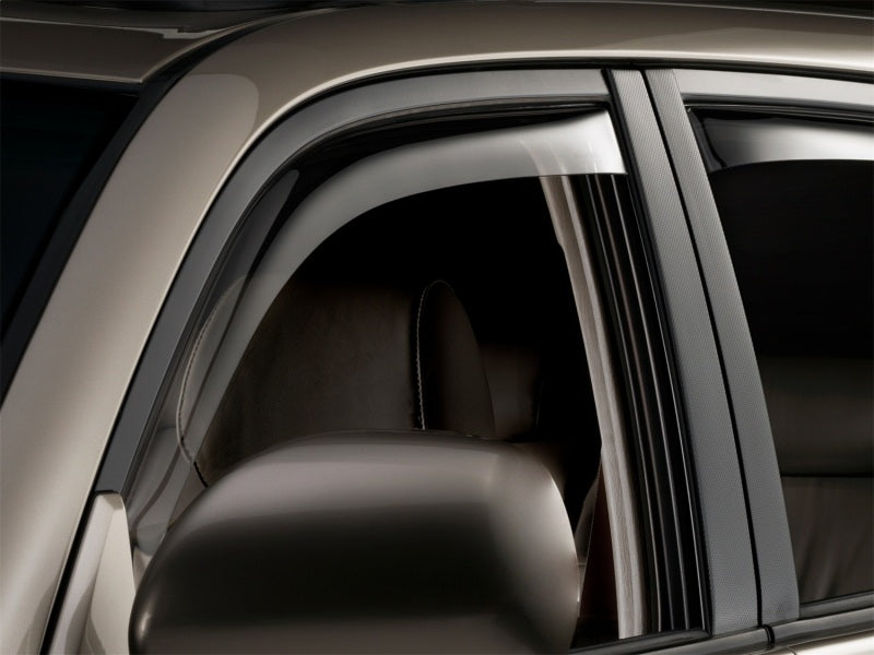 WeatherTech 03-09 Toyota 4Runner Front and Rear Side Window Deflectors - Dark Smoke installed on a vehicle Main image