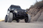 DV8 Offroad 18-23 Wrangler JL/Gladiator JT Spec Series Front Bumper on rugged terrain