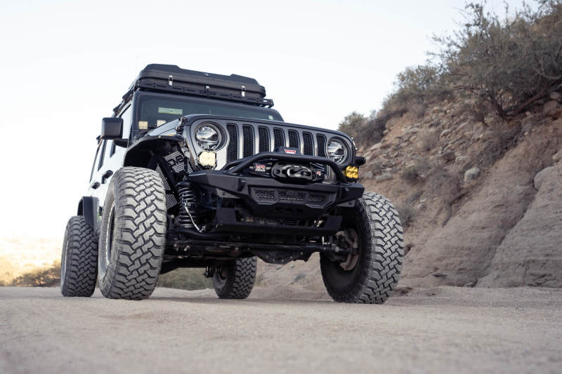 DV8 Offroad 18-23 Wrangler JL/Gladiator JT Spec Series Front Bumper on rugged terrain