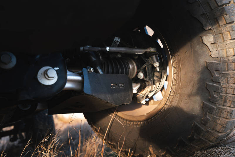 DV8 Offroad 21-22 Ford Bronco Front Lower Control Arm Skid Plate protecting suspension in off-road environment