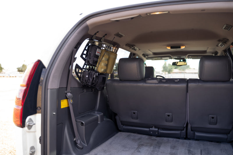 DV8 Offroad 03-09 Lexus GX 470 Rear Window Molle Storage Panels installed in vehicle interior.