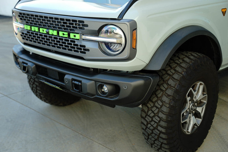 DV8 Offroad 2021 Ford Bronco Capable Bumper Slanted Front License Plate Mount on off-road vehicle.