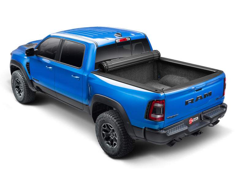 BAK 09-18 1500 Dodge Ram (19-20 Classic) w/o Ram Box Revolver X4s 5.7ft Bed Cover on blue truck