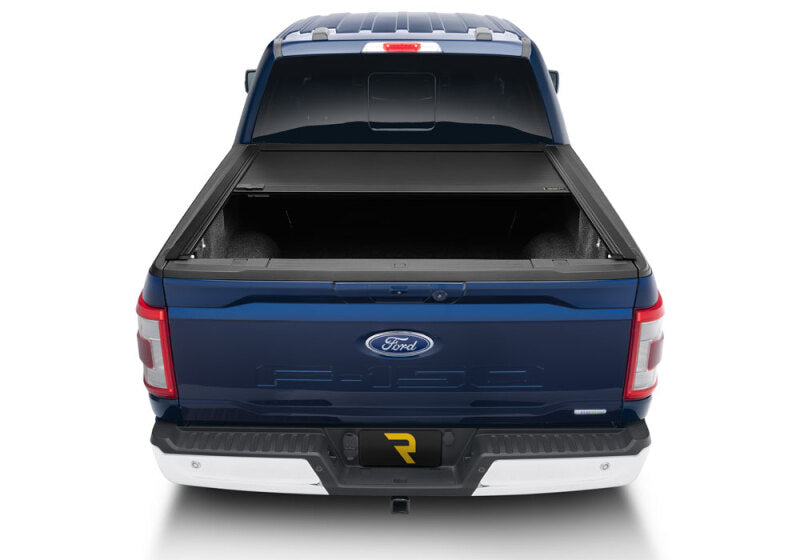 Retrax 21-22 Ford F-150 Super Crew/Super Cab (Incl. 2022 Lightning) 5.5ft Bed RetraxONE MX on a blue Ford truck rear view.