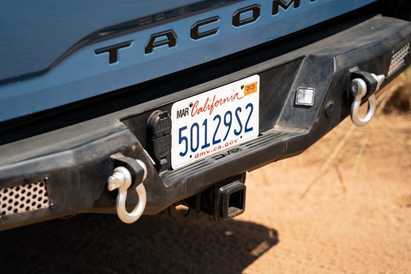 DV8 Offroad 16-23 Toyota Tacoma MTO Series Rear Bumper close-up with recovery gear hooks