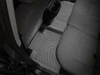 WeatherTech 16+ Toyota Tacoma Double Cab Rear FloorLiner - Black in a truck interior for ultimate protection.
