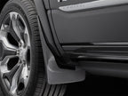 WeatherTech 19+ Dodge Ram w/ Factory Flares Front No Drill Mudflaps - Black close-up with tire and rim.