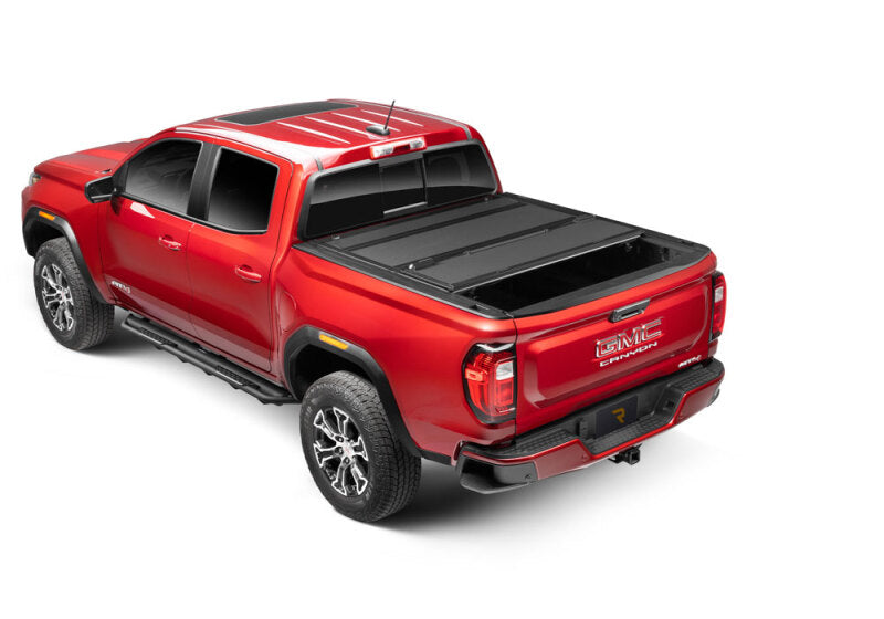 BAK 2024 Toyota Tacoma 6ft Bed BAKFlip MX4 Bed Cover on red truck