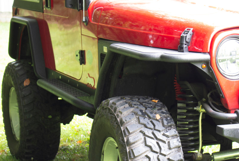 Fishbone Offroad 97-06 Jeep Wrangler TJ Steel Rock Slider - Black Textured Powdercoat on red Jeep