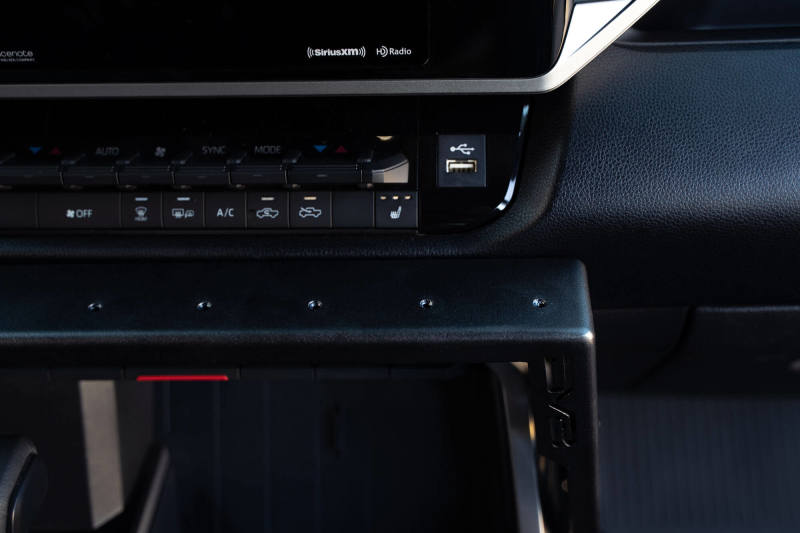 DV8 Offroad 22-23 Toyota Tundra Center Console Molle Panels/Device Mount showcasing modern interior design access