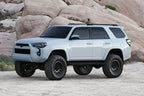 Fabtech 2015-21 Toyota 4Runner 4WD 6in Perf Sys w/Dl 2.5C/O & 2.25 with offroad wheels and tires