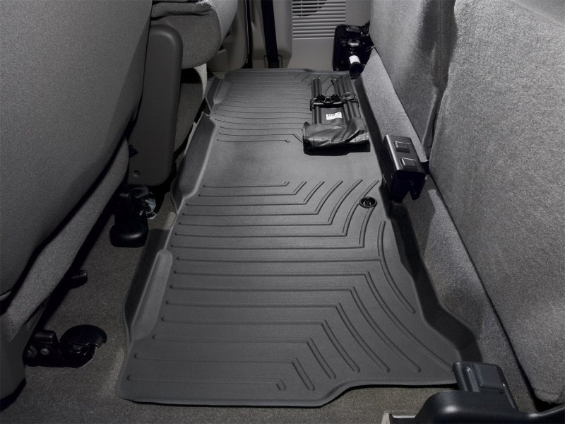WeatherTech 99-10 Ford F250 Super Duty Super Cab Rear FloorLiner - Black installed in vehicle interior