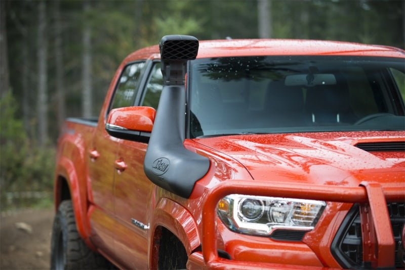 ARB Safari 4X4 Snorkel Armax Tacoma Gen3 3.5L 2Gr-Fks 9/15+ on an off-road truck for better air intake.