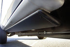 AMP Research 1999-2006 Chevy/GMC Silverado/Sierra Extended/Crew PowerStep - Black installed on truck, showcasing offroad performance upgrades.