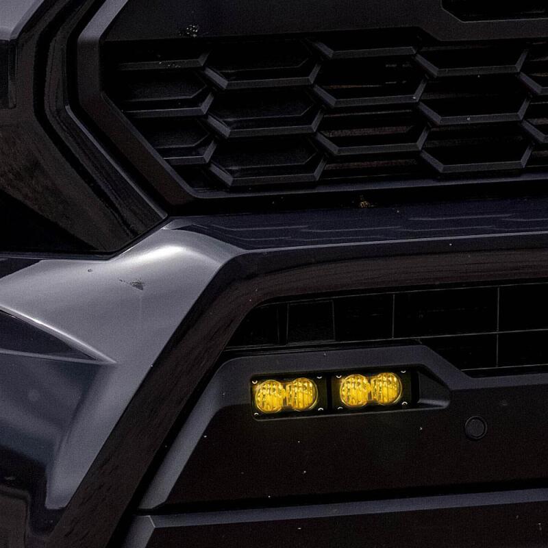 Baja Designs 2024+ Toyota Tacoma S2 Sport Dual Fog Pocket Light Kit - Baja Amber close-up on truck grille