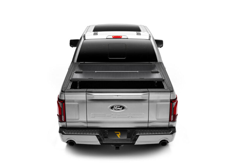 BAK 21-22 Ford F-150 (Incl. 2022 Lightning) BAKFlip G2 5.7ft Bed Cover on silver truck, perfect for offroad adventures.