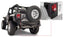 Bushwacker 07-18 Jeep Wrangler Trail Armor Rear Corners - Black on off-road vehicle with rugged tires.