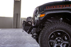 DV8 Offroad 07-23 Jeep Wrangler JK/JL & Gladiator JT FS-1 Series Stubby Front Bumper on black Jeep with offroad tires.