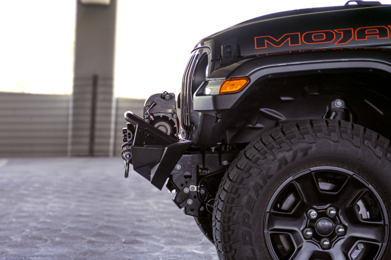 DV8 Offroad 07-23 Jeep Wrangler JK/JL & Gladiator JT FS-1 Series Stubby Front Bumper on black Jeep with offroad tires.