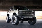 DV8 Offroad 21-22 Ford Bronco Competition Series Front Bumper installed on a lifted Bronco with offroad tires