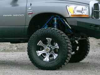 Offroad truck suspension lift kit with large tires and wheels