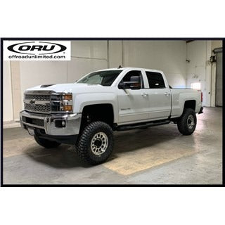 Chevy truck with ORU parts, featuring offroad suspension and wheels.