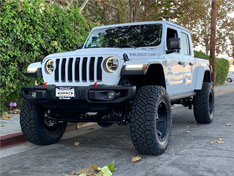 Gray Jeep Gladiator Rubicon with offroad tires and accessories.