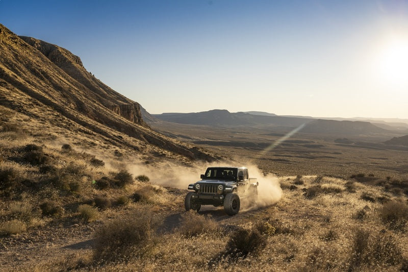 Fox 2018+ Jeep JL 2.0 Performance Series 8.2in. TS Stabilizer Bottom Axle Mount 5/8in Shaft in off-road action