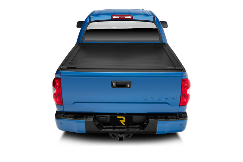 Retrax 2022+ Toyota Tundra (5.7ft Bed w/ Deck Rail System) RetraxONE XR Bed Cover on blue truck
